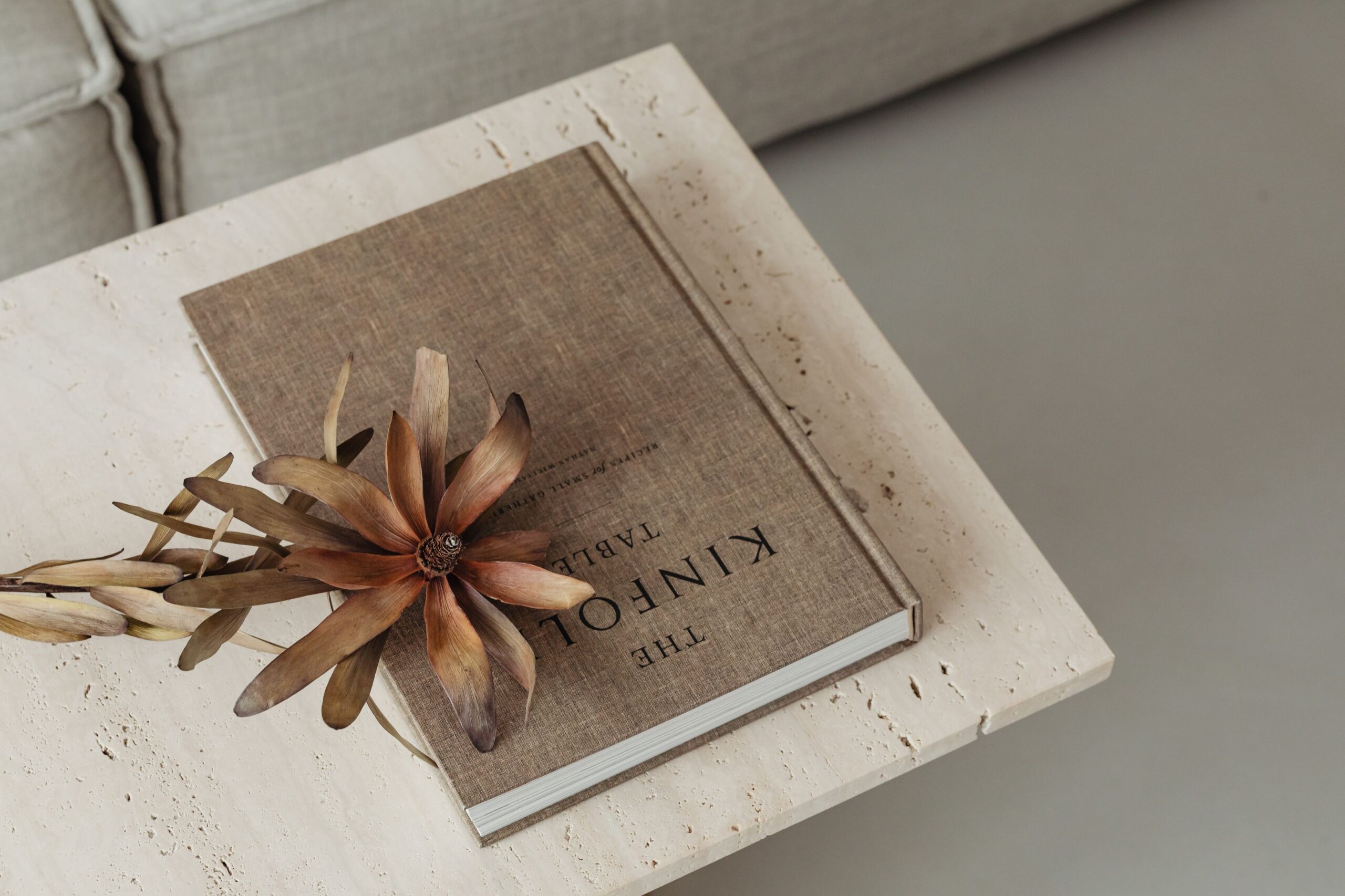 kaboompics_the-book-lies-on-a-travertine-table-kinfolk-dried-flower-27371